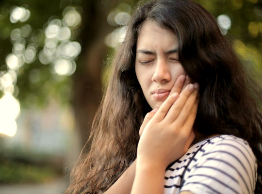 Woman experiencing toothache