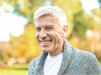 Man smiling after All-on-4 or All-on-6 full mouth restoration
