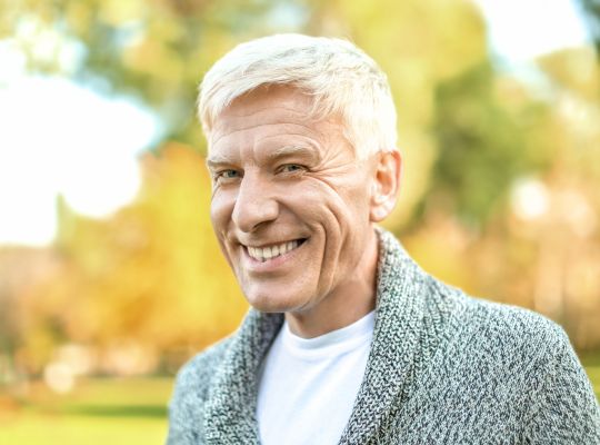 Man smiling after All-on-4 or All-on-6 full mouth restoration