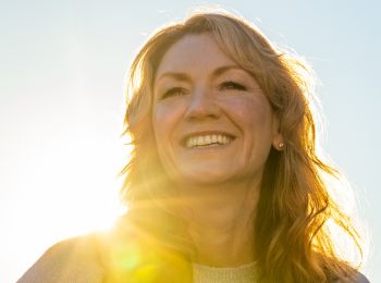 smiling woman with dental implants