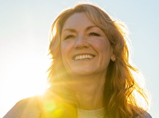 smiling woman with dental implants
