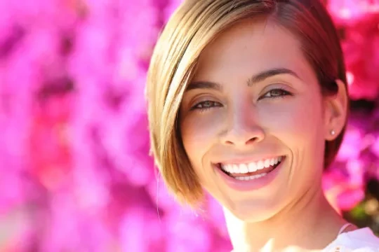 Short-haired woman smiling