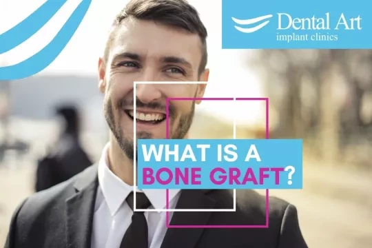 Smiling man in a suit. Text - What is a bone graft?